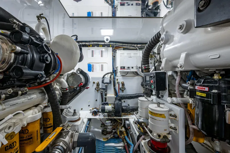 Flying B Yacht Photos Pics Engine room of 2018 French Yachts Custom Express Sportfish, showcasing complex machinery and components.
