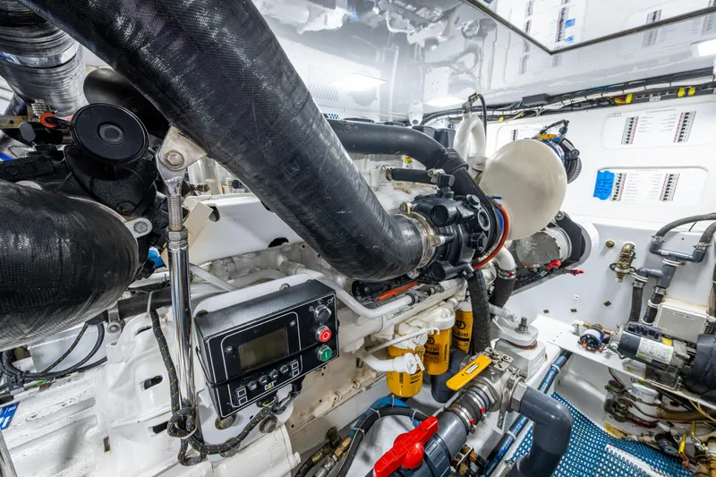 Flying B Yacht Photos Pics Engine room of 2018 French Yachts Custom Express Sportfish, showcasing complex machinery and components.