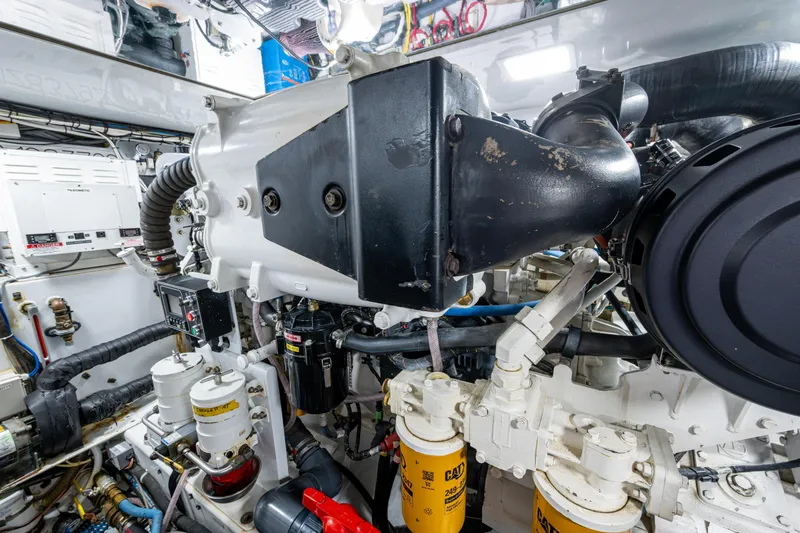 Flying B Yacht Photos Pics Engine room of 2018 French Yachts Custom Express Sportfish, showcasing mechanical components.