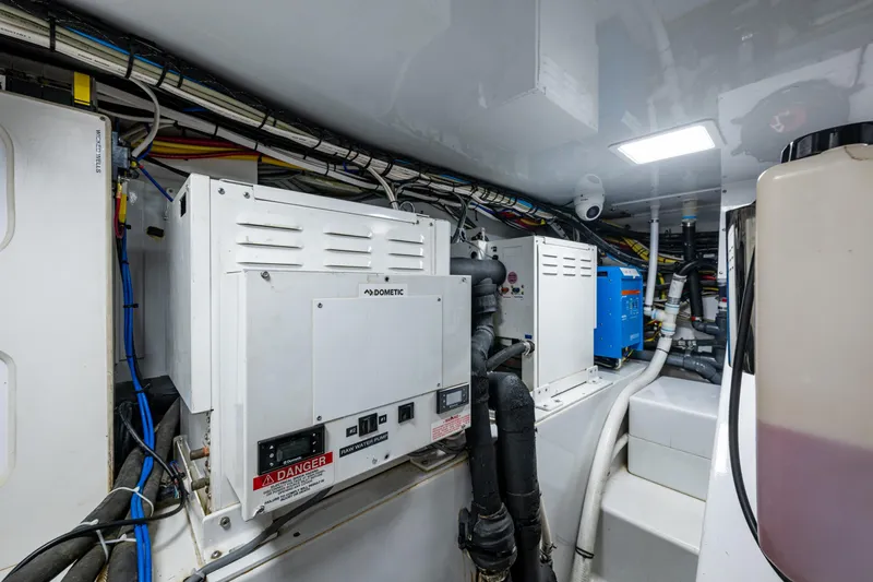 Flying B Yacht Photos Pics Engine room of 2018 French Yachts Custom Express Sportfish, featuring advanced equipment and wiring.