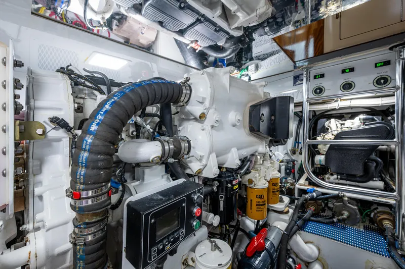 Flying B Yacht Photos Pics Engine room of 2018 French Yachts Custom Express Sportfish, showcasing complex machinery and components.
