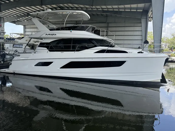 Mojo Yacht Photos Pics Aquila 44 Yacht 2020 model docked in a covered marina.