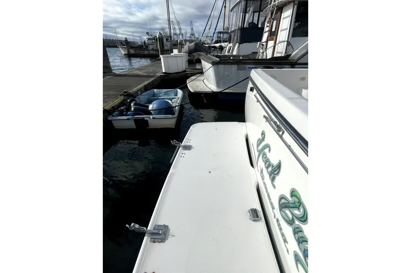 Yeah Buddy Yacht Photos Pics 2001 Bayliner 3988 Command Bridge Motoryacht docked at marina with small boat nearby.