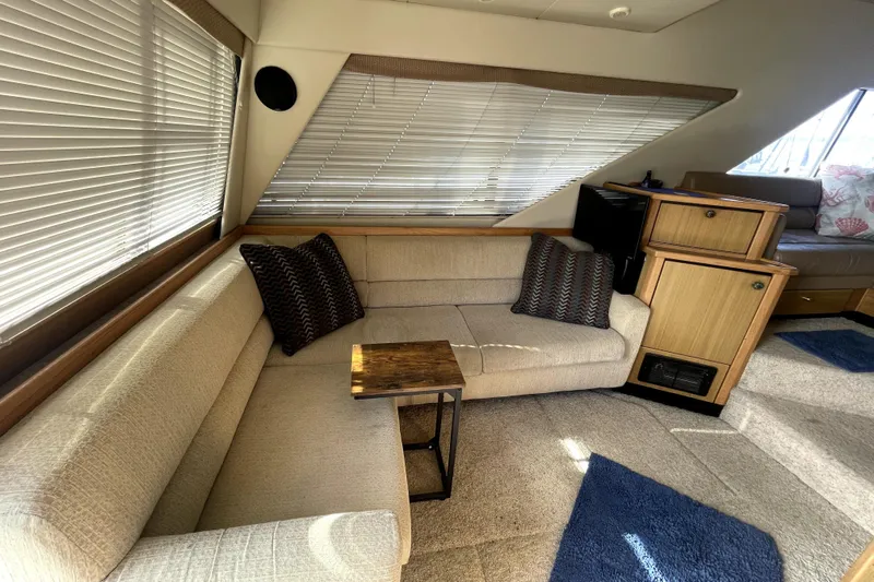 Yeah Buddy Yacht Photos Pics Interior of 2001 Bayliner 3988 Command Bridge Motoryacht with cozy seating and wooden accents.