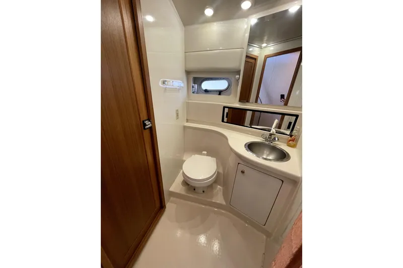 Yeah Buddy Yacht Photos Pics 2001 Bayliner 3988 Command Bridge Motoryacht bathroom with sink, toilet, and mirror.