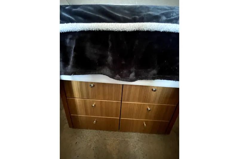 Yeah Buddy Yacht Photos Pics Wooden drawers with a dark blanket, Bayliner 3988 Command Bridge Motoryacht, 2001 interior.