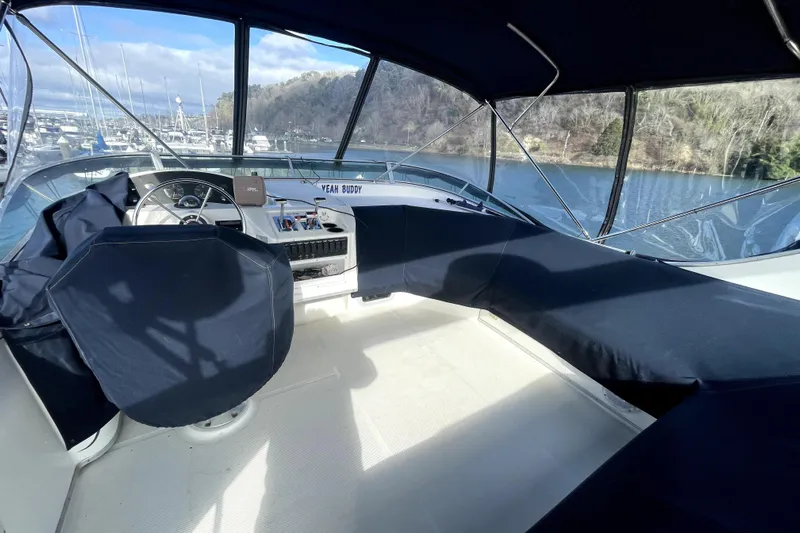 Yeah Buddy Yacht Photos Pics 2001 Bayliner 3988 Command Bridge Motoryacht interior with covered seating and steering wheel.