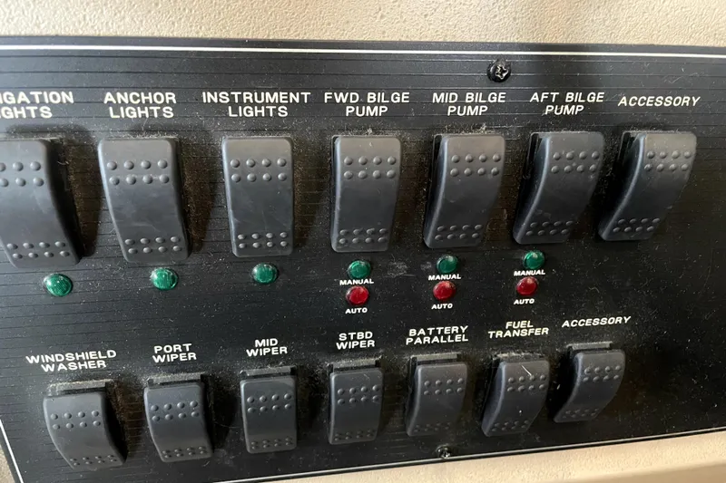 Yeah Buddy Yacht Photos Pics Control panel of a 2001 Bayliner 3988 Command Bridge Motoryacht with labeled switches.