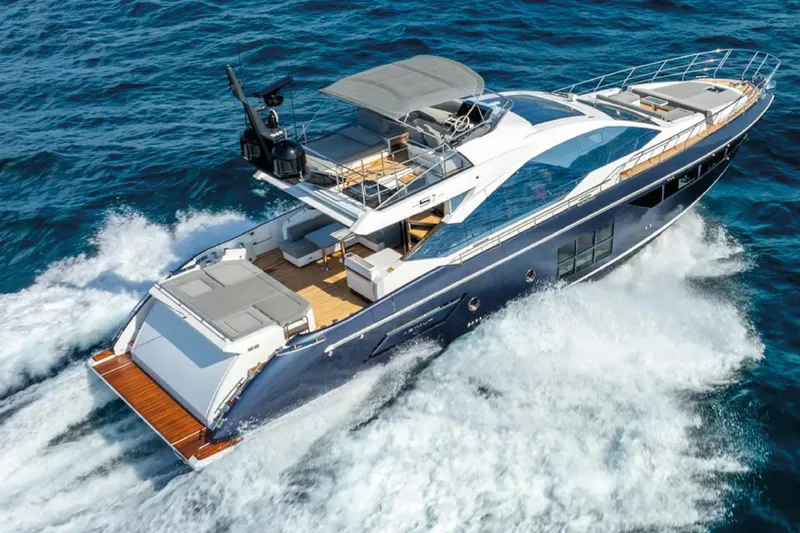 No Name Yacht Photos Pics Luxurious 2019 Azimut S7 yacht cruising on open sea, showcasing sleek design and elegance.