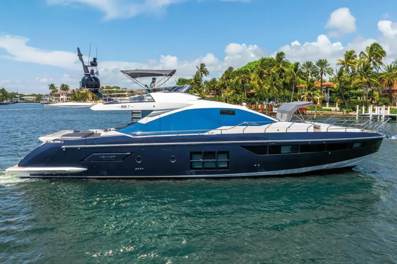No Name Yacht Photos Pics 2019 Azimut S7 yacht cruising on a sunny day near palm-lined shore.