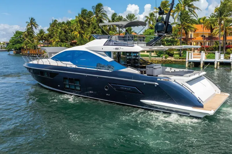 No Name Yacht Photos Pics Luxurious 2019 Azimut S7 yacht cruising near tropical shoreline with palm trees.