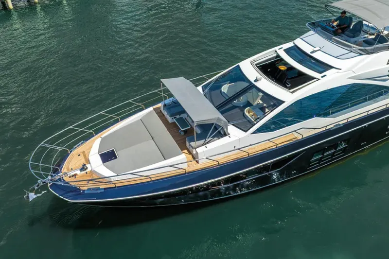 No Name Yacht Photos Pics 2019 Azimut S7 yacht cruising on clear water, showcasing sleek design and luxury features.
