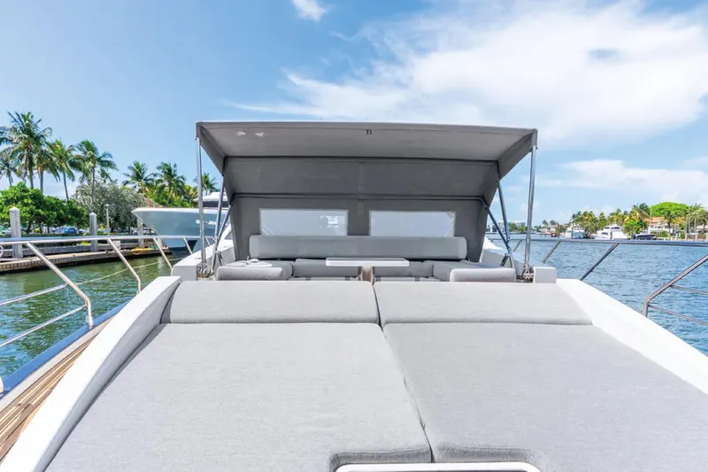 No Name Yacht Photos Pics 2019 Azimut S7 yacht with sunbathing deck, docked by palm trees and blue sky.