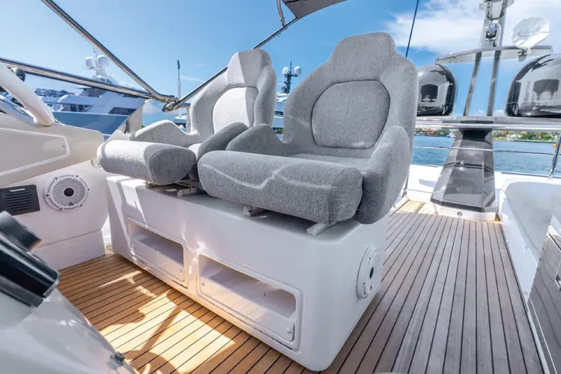 No Name Yacht Photos Pics Luxurious 2019 Azimut S7 yacht interior with plush gray seating and sleek wooden flooring.