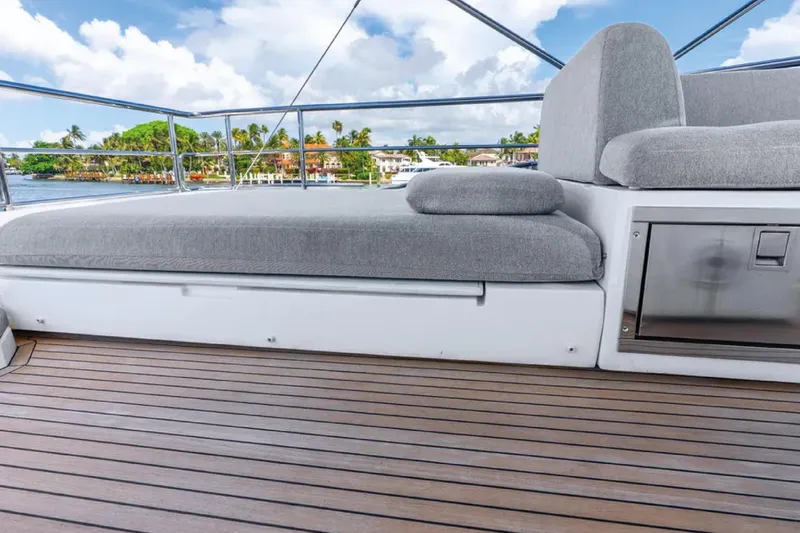 No Name Yacht Photos Pics 2019 Azimut S7 yacht deck with gray seating and scenic waterfront view.