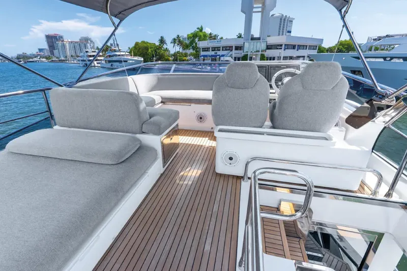 No Name Yacht Photos Pics Luxurious 2019 Azimut S7 yacht with spacious deck and modern seating, docked in a marina.