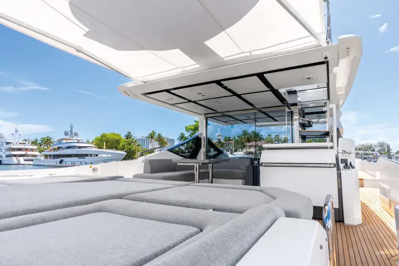 No Name Yacht Photos Pics Luxurious 2019 Azimut S7 yacht deck with modern seating and scenic marina view.