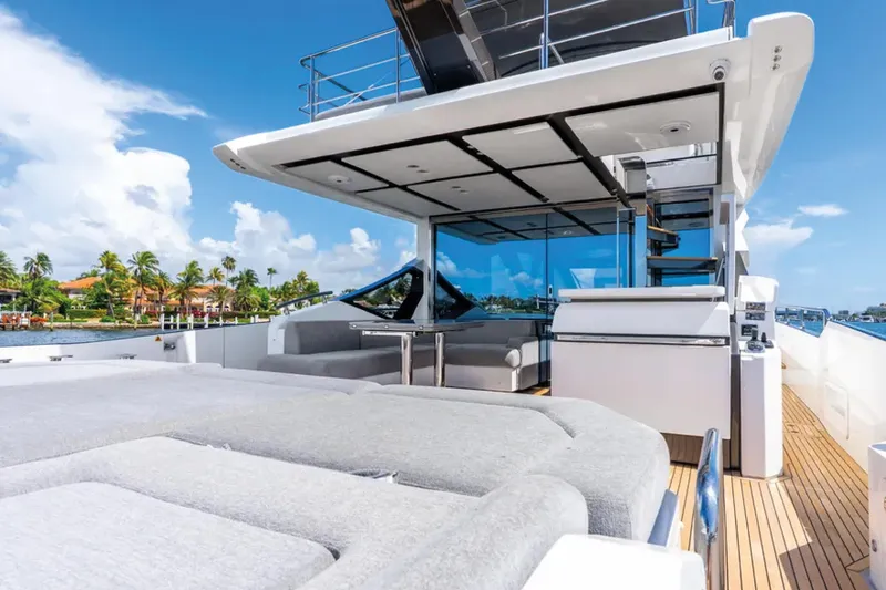 No Name Yacht Photos Pics Luxurious 2019 Azimut S7 yacht deck with modern seating and scenic waterfront view.