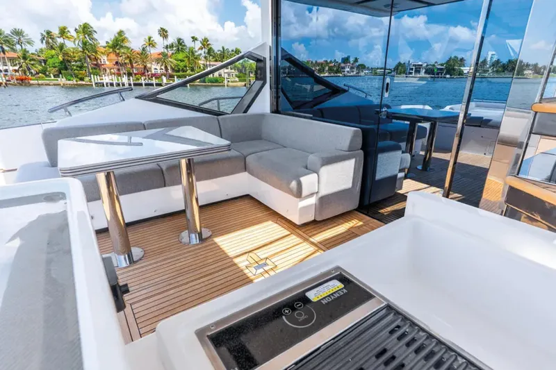 No Name Yacht Photos Pics Luxurious 2019 Azimut S7 yacht interior with modern seating and scenic waterfront view.