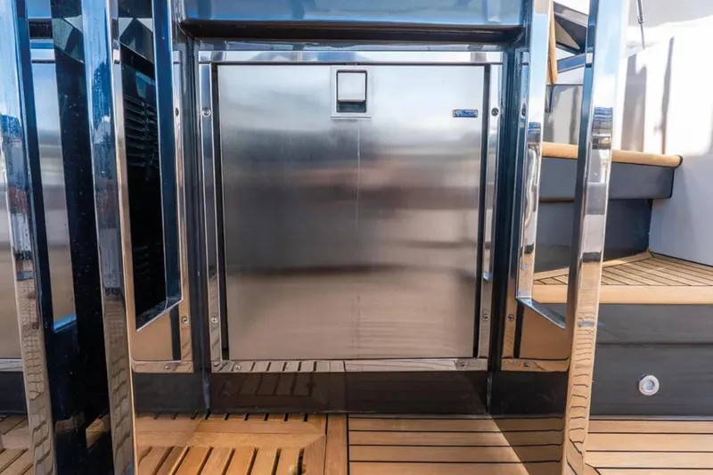 No Name Yacht Photos Pics 2019 Azimut S7 yacht interior with stainless steel door and wooden flooring.