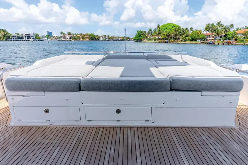 No Name Yacht Photos Pics Luxurious 2019 Azimut S7 yacht deck with cushioned seating, overlooking serene waterfront.