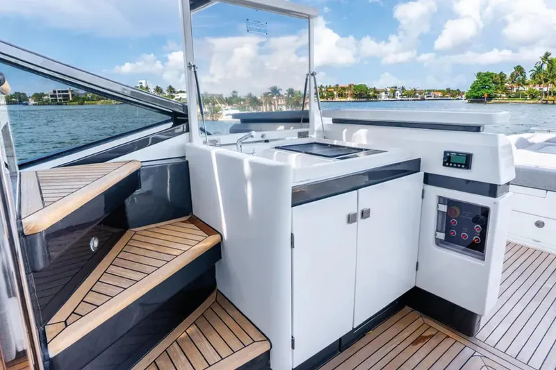 No Name Yacht Photos Pics 2019 Azimut S7 yacht deck with modern outdoor kitchen and wooden stairs.
