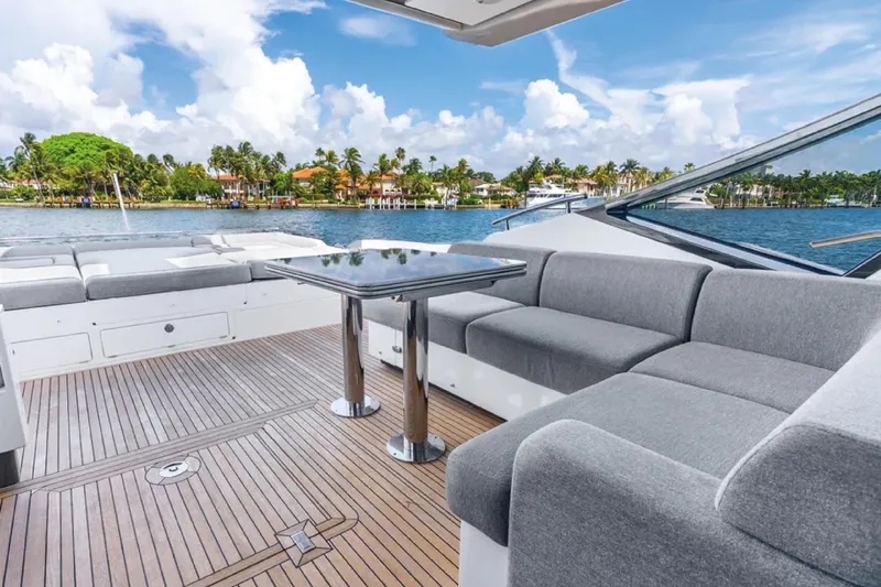 No Name Yacht Photos Pics Luxurious 2019 Azimut S7 yacht deck with elegant seating and scenic waterfront view.