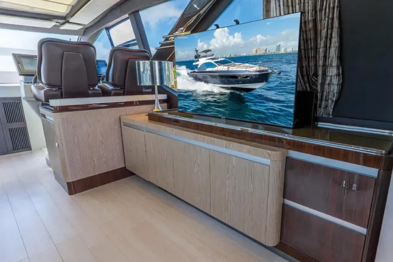 No Name Yacht Photos Pics Luxurious interior of 2019 Azimut S7 yacht with modern furnishings and large TV display.