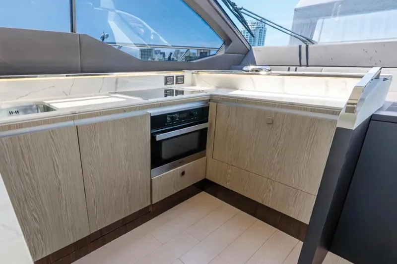 No Name Yacht Photos Pics Modern kitchen interior of 2019 Azimut S7 yacht with sleek cabinetry and appliances.