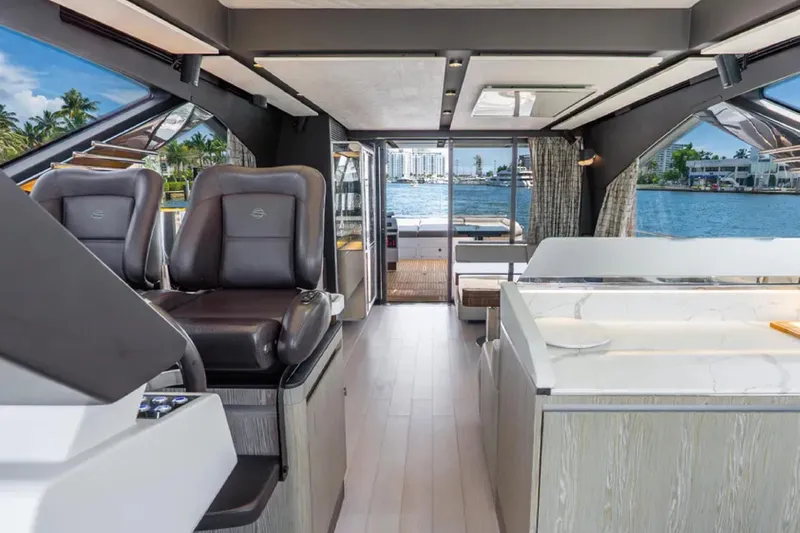 No Name Yacht Photos Pics Luxurious interior of 2019 Azimut S7 yacht with modern seating and waterfront view.