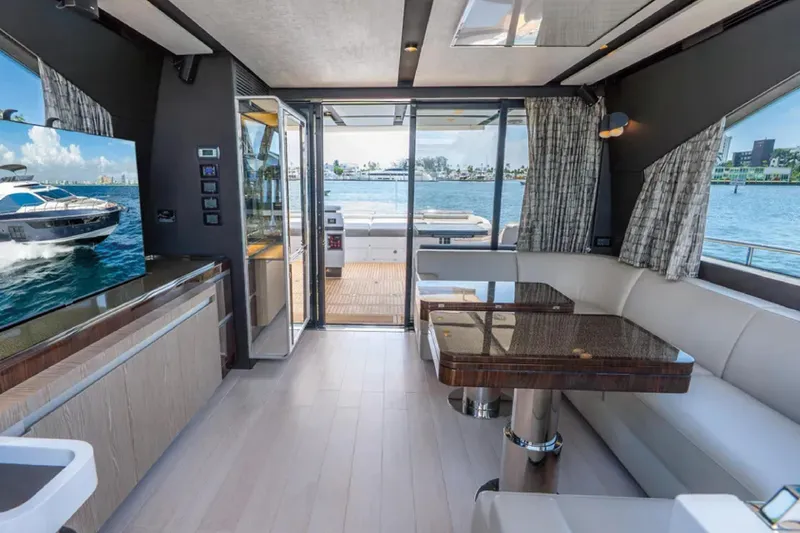 No Name Yacht Photos Pics Luxurious interior of 2019 Azimut S7 yacht with elegant seating and scenic ocean view.