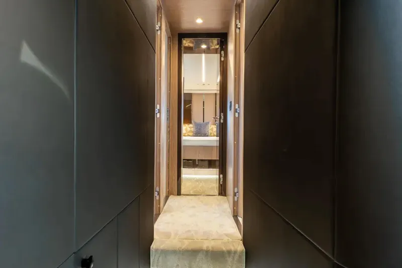 No Name Yacht Photos Pics Luxurious interior hallway of 2019 Azimut S7 yacht leading to a cozy bedroom.