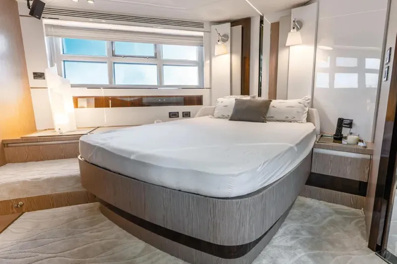 No Name Yacht Photos Pics Luxurious bedroom interior of 2019 Azimut S7 yacht with modern design and large windows.