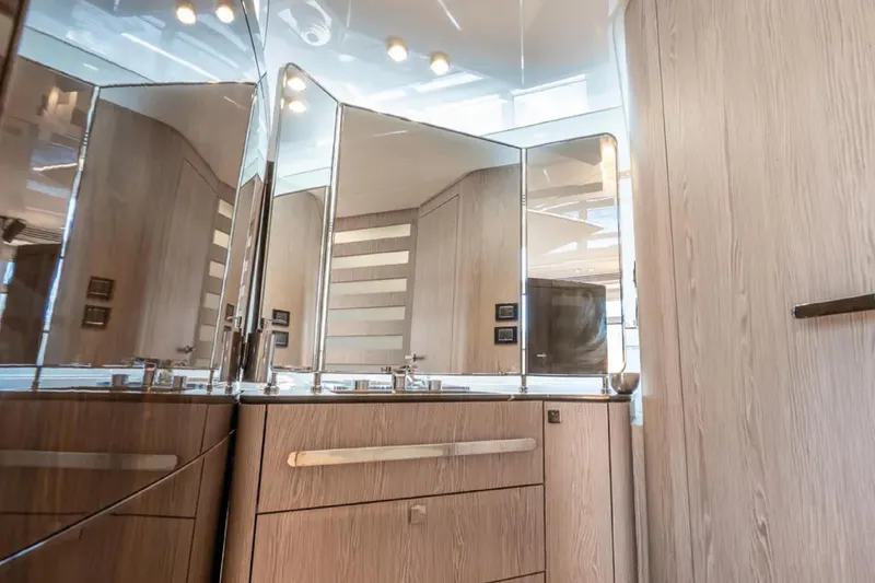 No Name Yacht Photos Pics Luxurious bathroom interior of 2019 Azimut S7 yacht with modern fixtures and wood finish.