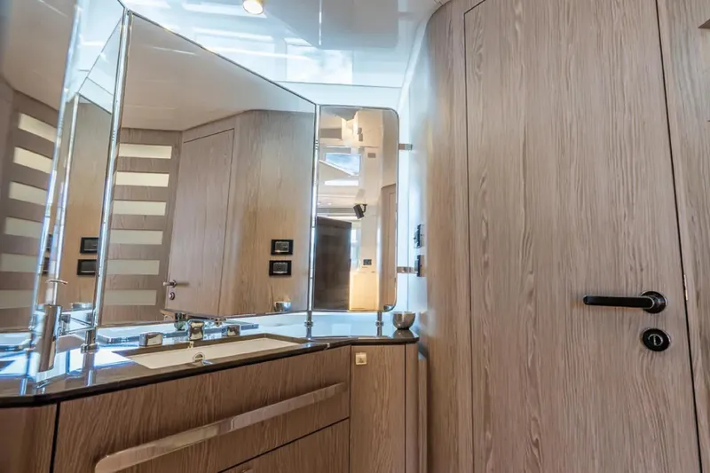No Name Yacht Photos Pics Luxurious bathroom interior of 2019 Azimut S7 yacht with modern wood finish.