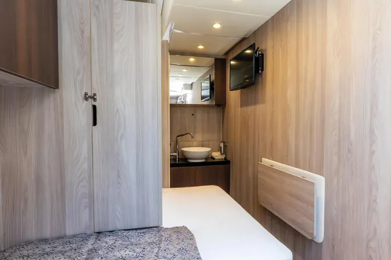 No Name Yacht Photos Pics Interior of 2019 Azimut S7 yacht cabin with modern wood paneling and compact amenities.