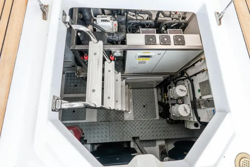 No Name Yacht Photos Pics Engine compartment of 2019 Azimut S7 yacht, featuring mechanical components and access ladder.