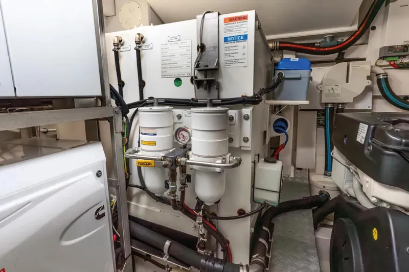 No Name Yacht Photos Pics Engine room of a 2019 Azimut S7 yacht, showcasing mechanical components and systems.