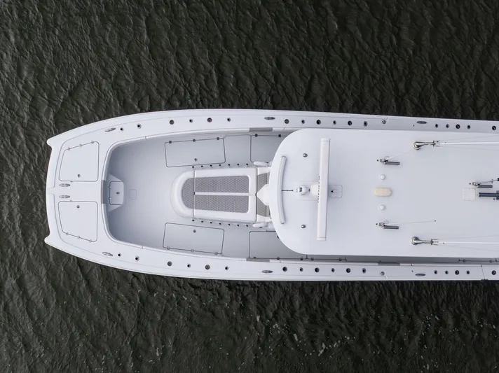  Yacht Photos Pics Aerial view of 2023 Freeman 43 boat on water, showcasing sleek design and spacious deck.