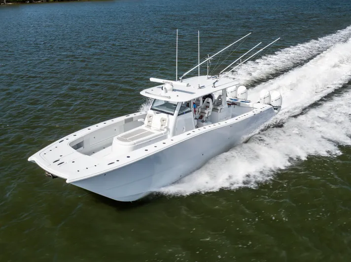  Yacht Photos Pics 2023 Freeman 43 boat cruising on water, showcasing sleek design and powerful performance.