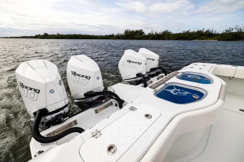  Yacht Photos Pics Freeman 43 boat with powerful outboard engines on a serene waterway, 2023 model.