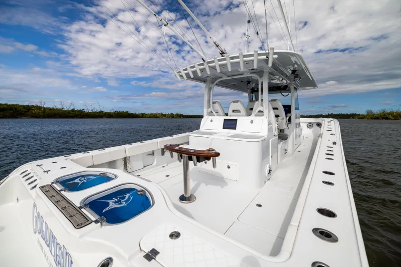  Yacht Photos Pics 2023 Freeman 43 boat on water, featuring spacious deck and fishing equipment.