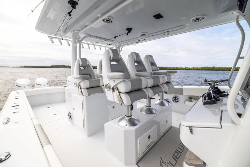  Yacht Photos Pics 2023 Freeman 43 boat interior with sleek seating and modern design on open water.