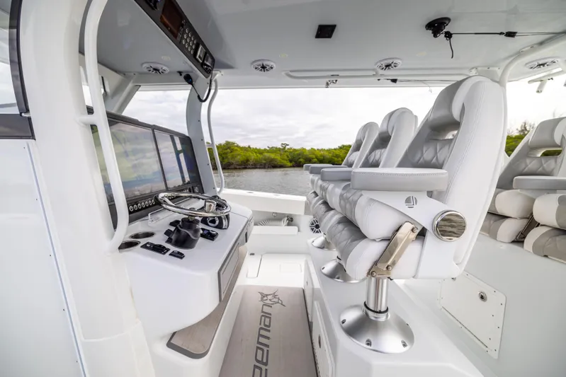  Yacht Photos Pics Interior of 2023 Freeman 43 boat with modern helm and luxurious seating.