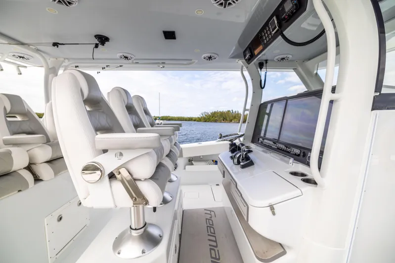  Yacht Photos Pics Interior of 2023 Freeman 43 boat with modern seating and navigation equipment.