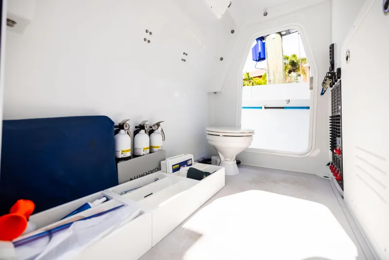  Yacht Photos Pics Interior of a 2023 Freeman 43 boat featuring a compact bathroom with essential equipment.