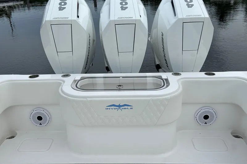  Yacht Photos Pics 2023 Invincible 36 Open Fisherman with triple Mercury 400 engines on calm water.