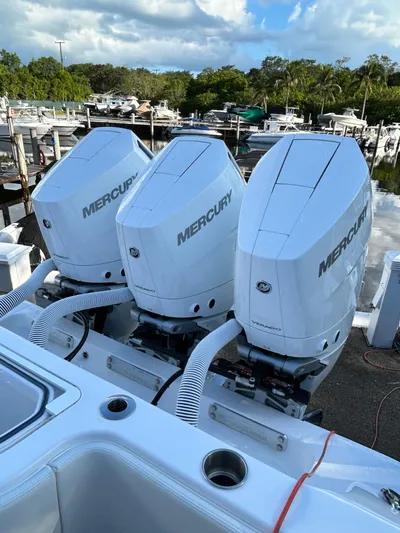  Yacht Photos Pics Triple Mercury outboard engines on 2023 Invincible 36 Open Fisherman boat at marina.