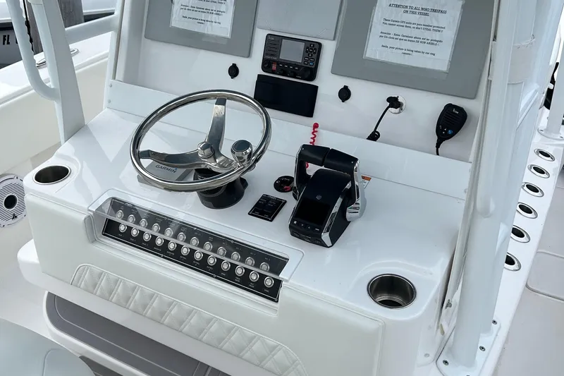  Yacht Photos Pics Control panel of 2023 Invincible 36 Open Fisherman boat with steering wheel and electronics.