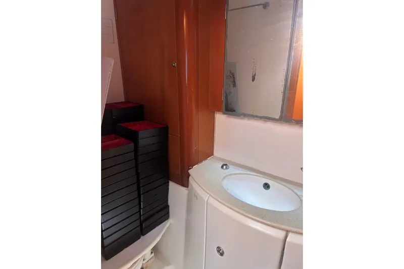 Dos Yacht Photos Pics Bathroom interior of 2005 Lagoon 440 yacht with sink and mirror.